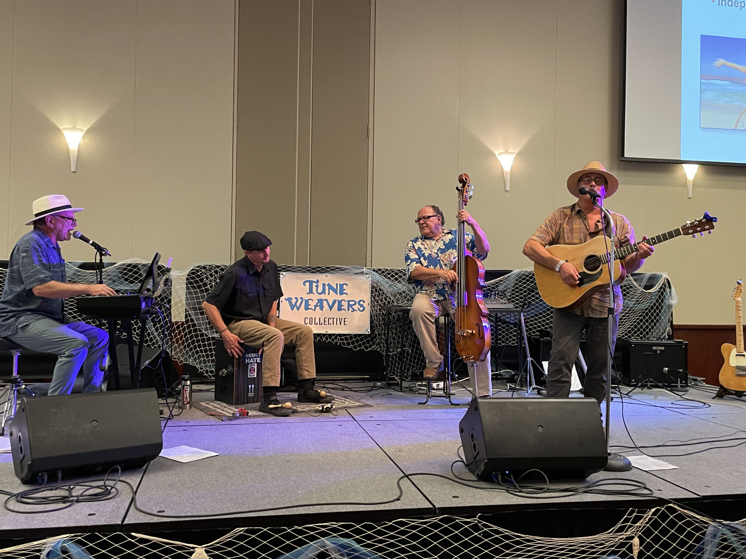 Four musicians perform on stage at CMU ballroom.